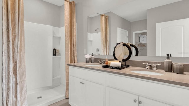 bathroom with vanity, tile patterned floors, and curtained shower