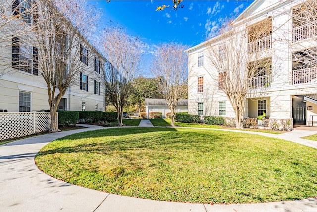 surrounding community featuring a lawn