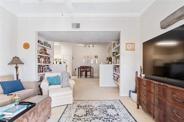 carpeted living room with ornamental molding and built in features