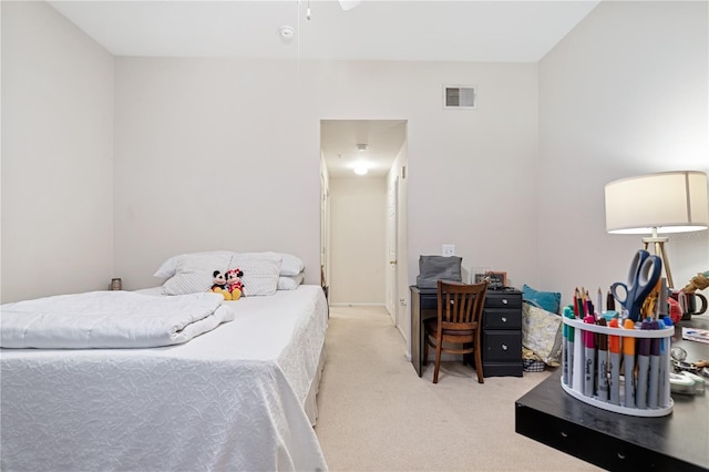 bedroom with light carpet