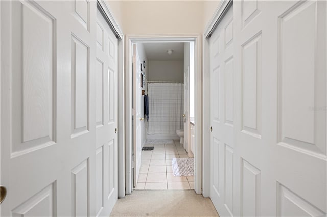 corridor featuring light tile patterned flooring