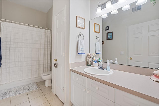 full bathroom with tile patterned floors, toilet, shower / tub combo, and vanity