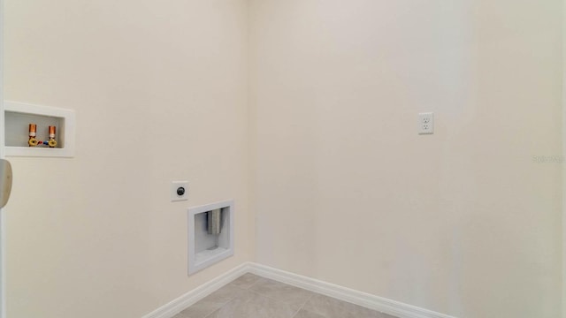 clothes washing area with electric dryer hookup, light tile patterned floors, and hookup for a washing machine