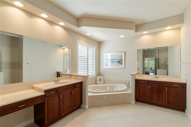 bathroom featuring tile patterned flooring, vanity, and separate shower and tub