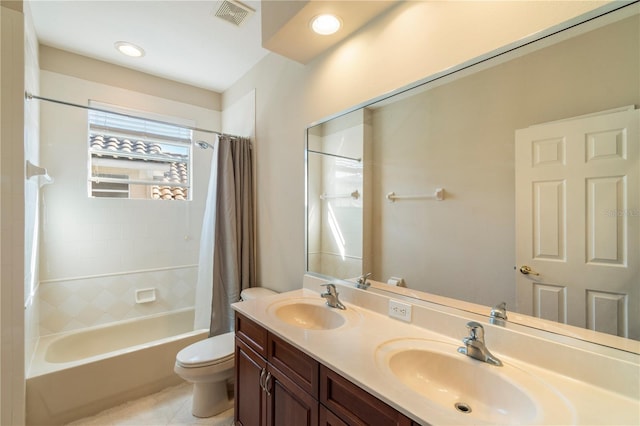 full bathroom featuring toilet, vanity, tile patterned floors, and shower / bathtub combination with curtain