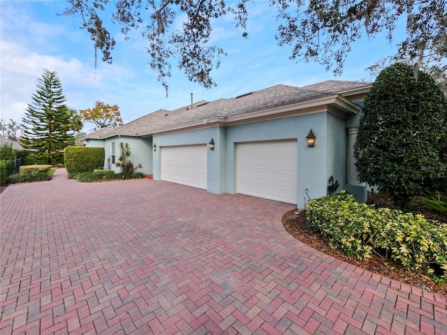 view of side of property featuring a garage