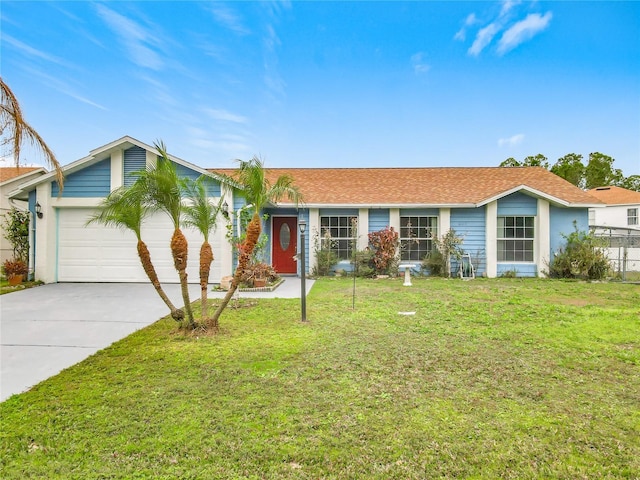 ranch-style home with a front yard and a garage