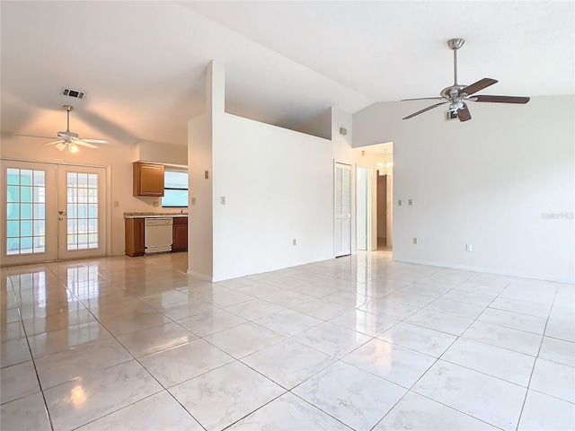 spare room with ceiling fan, french doors, and vaulted ceiling