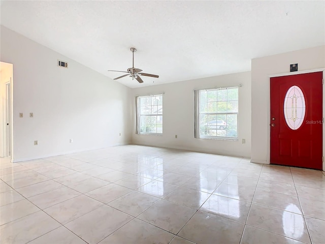 entryway with ceiling fan and lofted ceiling