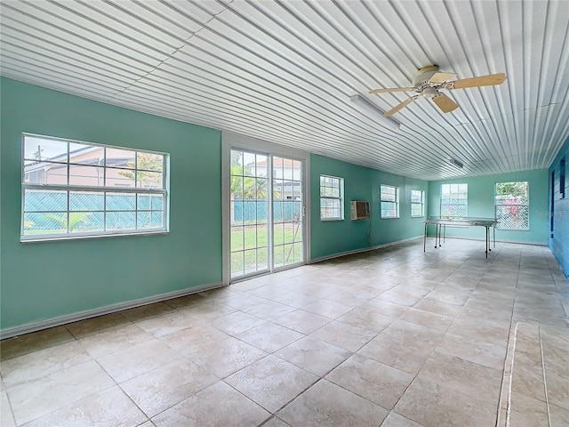 interior space with ceiling fan and lofted ceiling