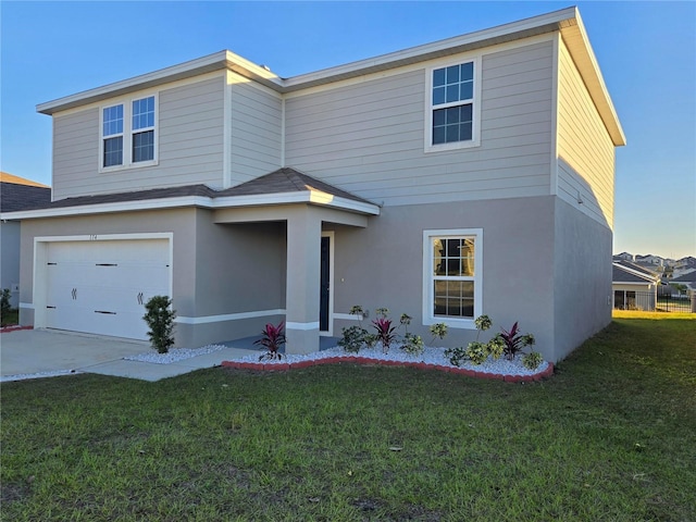 view of front of home with a garage and a front yard