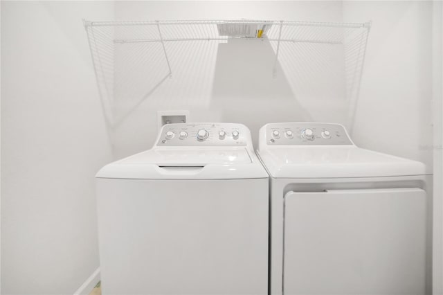 laundry area with separate washer and dryer