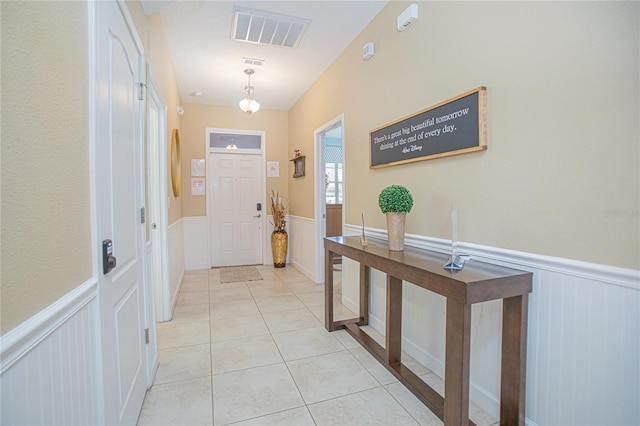 doorway to outside featuring light tile patterned floors