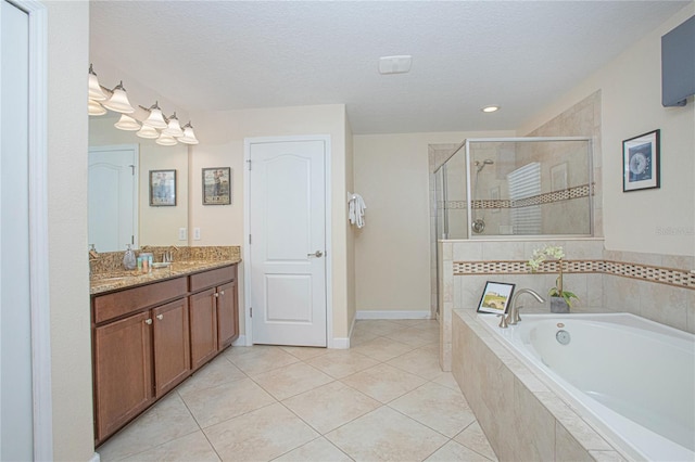 bathroom featuring tile patterned floors, vanity, independent shower and bath, and a textured ceiling