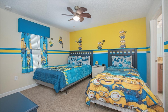 carpeted bedroom featuring ceiling fan and a textured ceiling