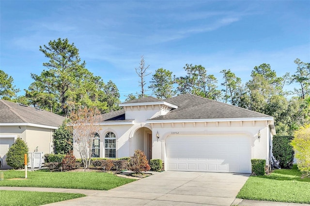 ranch-style home with a front lawn and a garage