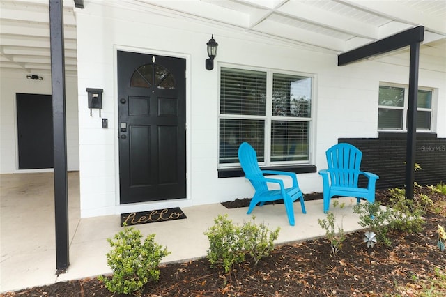 doorway to property with a porch