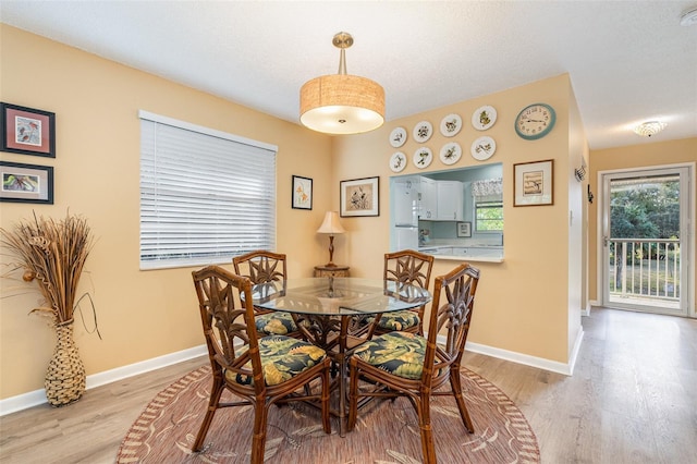 dining area with light wood-type flooring