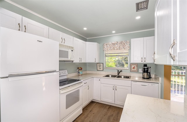 kitchen with light stone countertops, sink, dark hardwood / wood-style floors, white appliances, and white cabinets