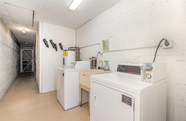 washroom with washer and dryer and electric water heater