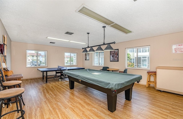 game room featuring light hardwood / wood-style flooring, plenty of natural light, and billiards