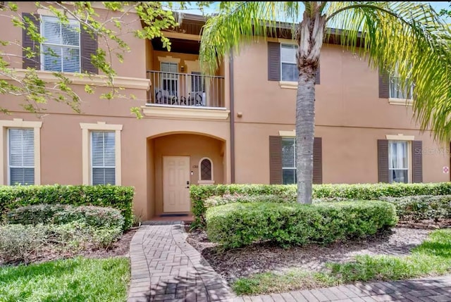 view of front of property with a balcony