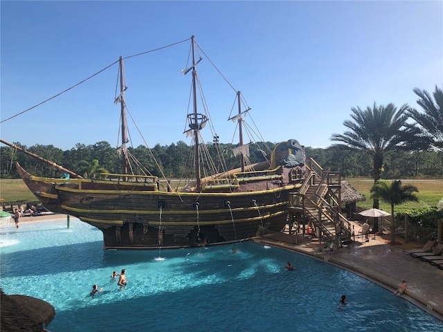 view of pool featuring pool water feature