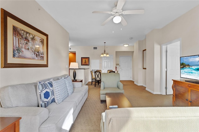 carpeted living room featuring ceiling fan