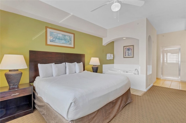 tiled bedroom featuring ceiling fan