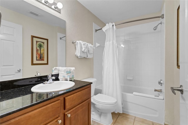 full bathroom with shower / tub combo, vanity, toilet, and tile patterned flooring