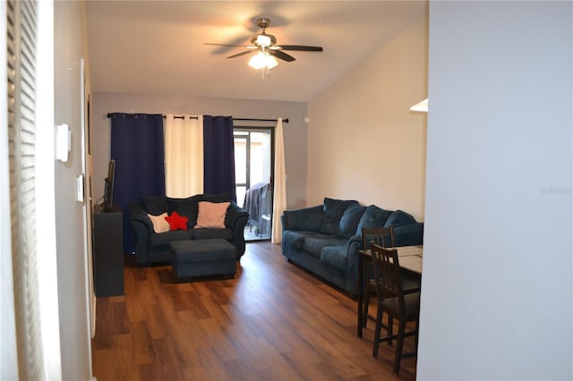 living room featuring dark hardwood / wood-style floors and ceiling fan