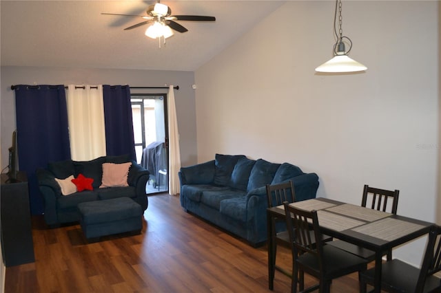 living room featuring dark hardwood / wood-style flooring, ceiling fan, and lofted ceiling