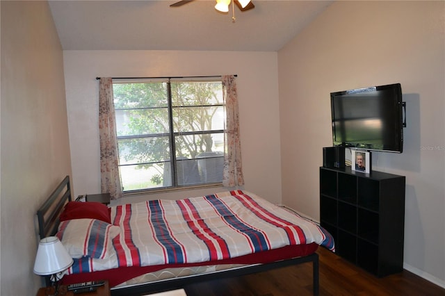 bedroom featuring hardwood / wood-style floors, ceiling fan, and vaulted ceiling