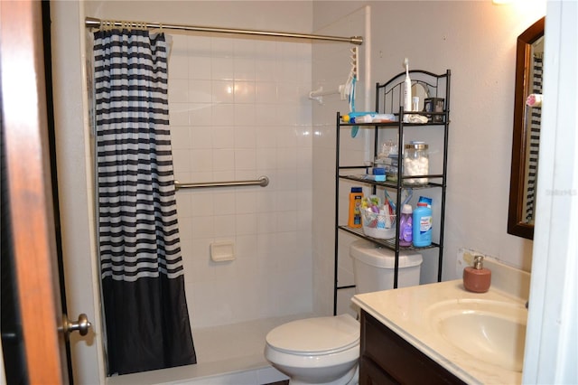 bathroom with a shower with curtain, vanity, and toilet