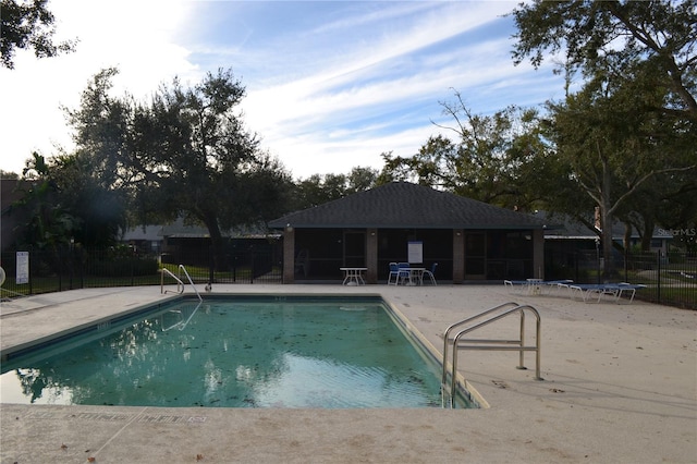 view of pool with a patio and a trampoline