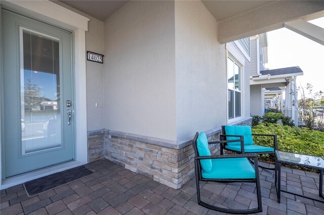 doorway to property featuring a patio