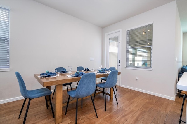 dining space featuring hardwood / wood-style floors