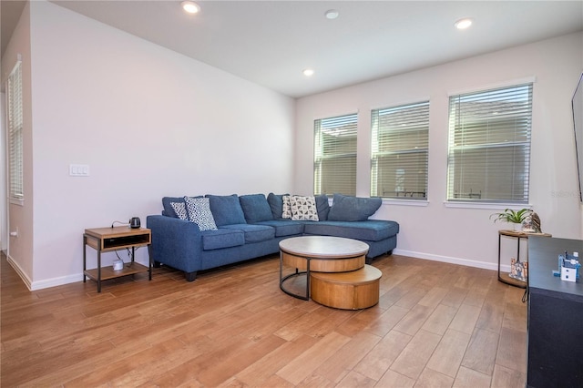 living room with light hardwood / wood-style flooring