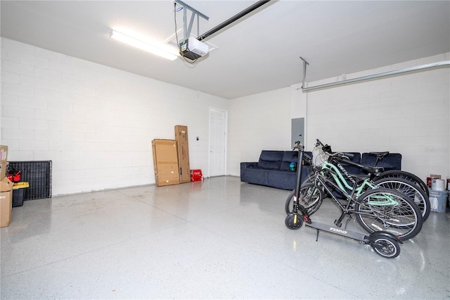 garage with electric panel and a garage door opener