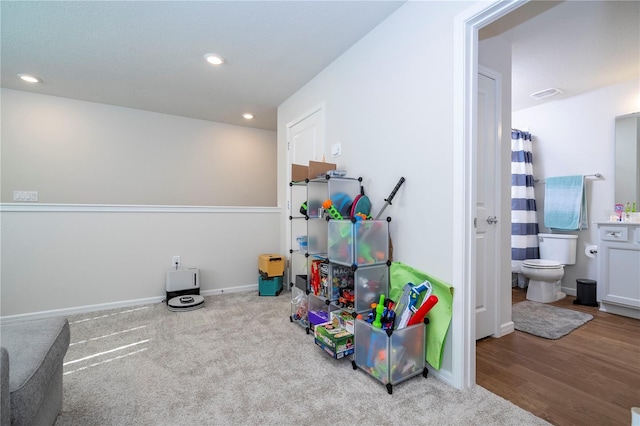 game room with light wood-type flooring