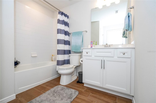 full bathroom with vanity, toilet, and shower / bath combo with shower curtain