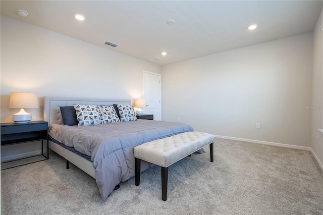 bedroom featuring light colored carpet