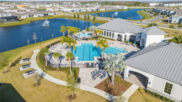 birds eye view of property featuring a water view