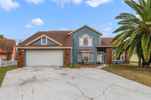 view of front facade with a garage and a front yard