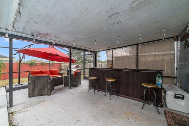 view of patio / terrace with area for grilling, an outdoor bar, and an outdoor hangout area