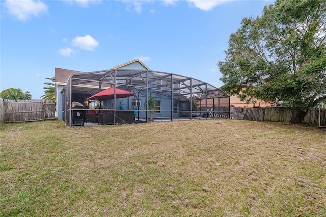 view of yard with a lanai