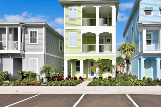 view of front of house with a balcony