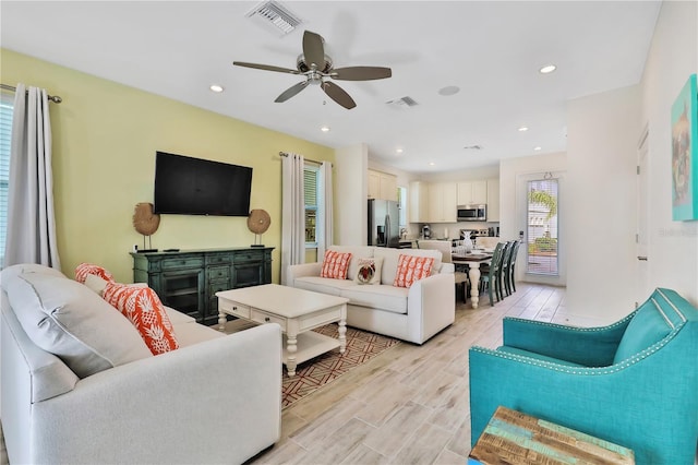 living room featuring ceiling fan