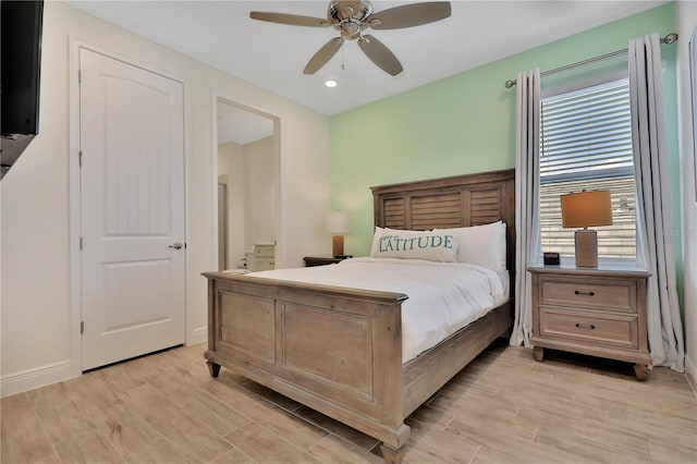 bedroom with ceiling fan and multiple windows