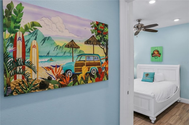 bedroom featuring ceiling fan and wood-type flooring